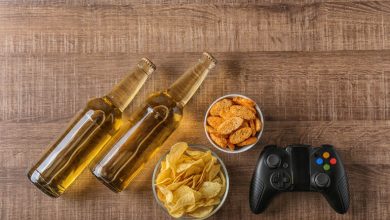 Gamers enjoying beer and snacks during a casual gaming session.