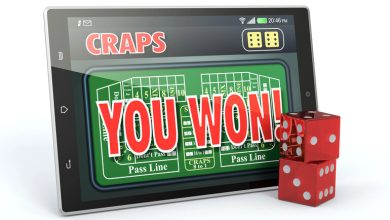 Tablet showing an online craps game with “You Won” and red dice in front.