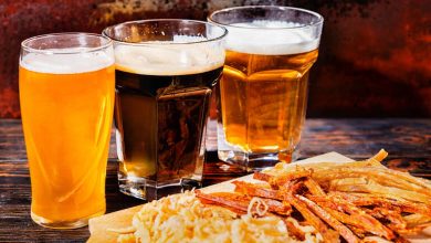 Beer in glasses, 3 types of beer included a hazy pale brew, a dark stout, and a golden lager.