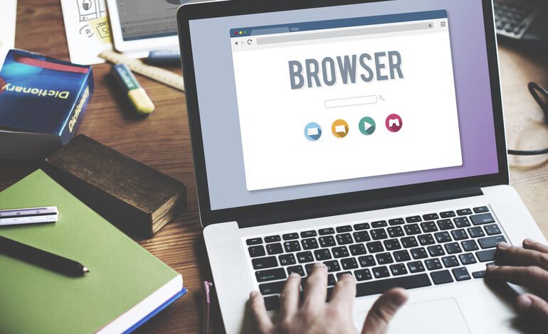 User working on a laptop with a web browser interface open.