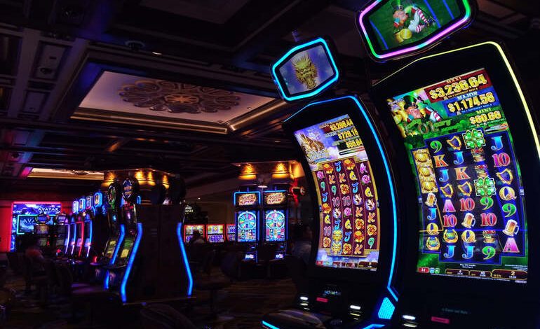 Neon-lit casino floor with slot machines and immersive lighting.